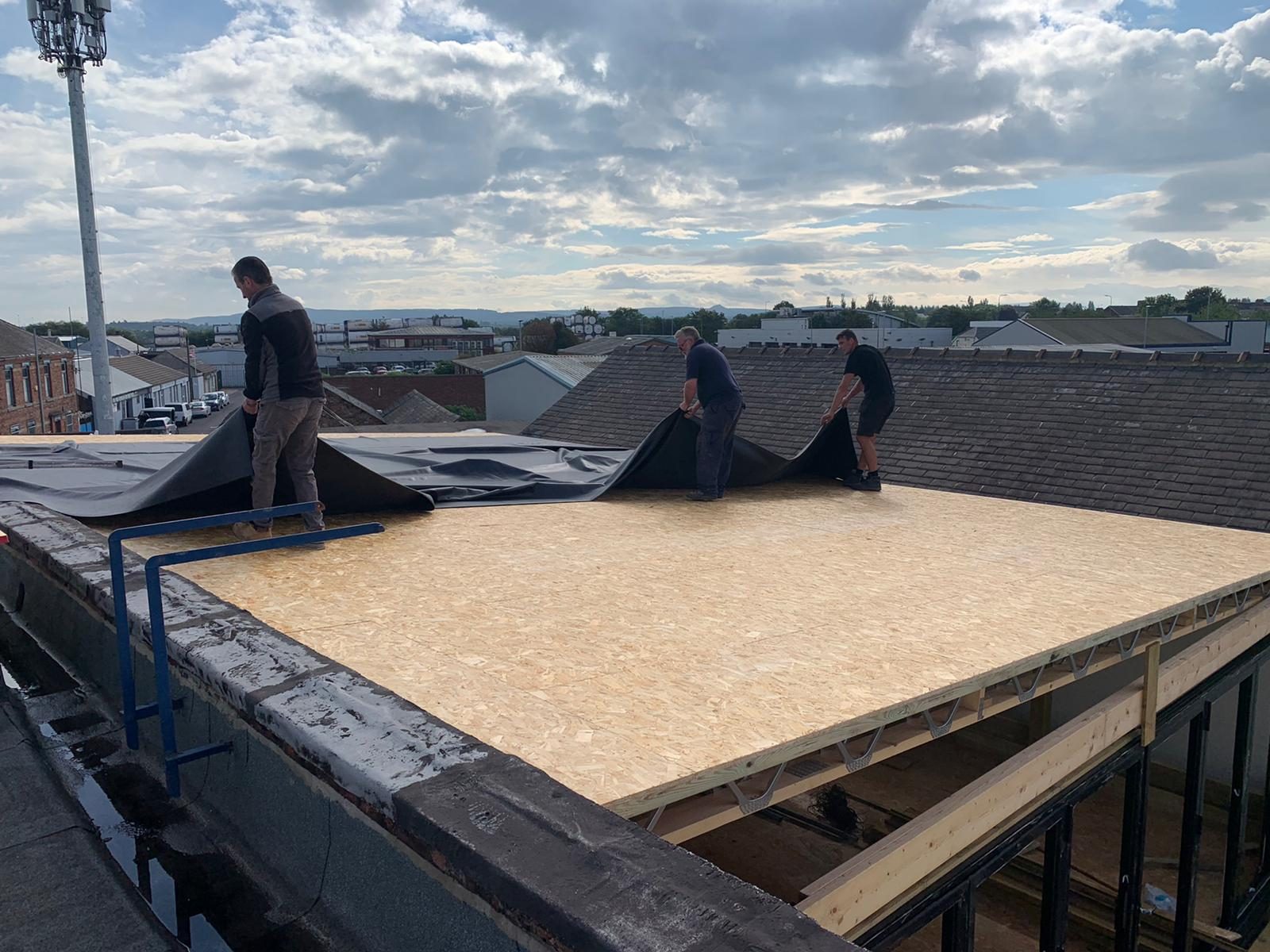 An EPDM rubber flat roof installation